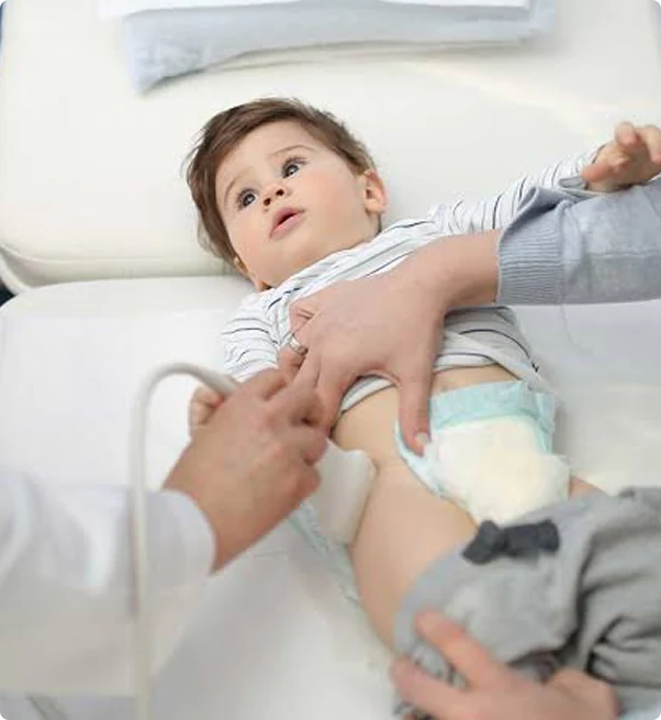 Consultant orthopaedic examination of infant hip at LIPS Healthcare London